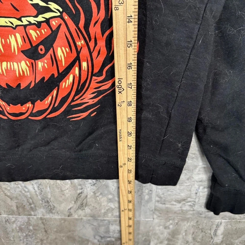 Black crewneck sweatshirt with yellow SET IT OFF flaming jack-o'-lantern size S